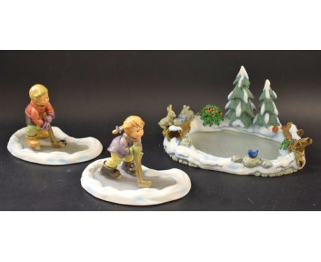 A Goebel modern Hummel figure, Lets Take to the Ice, boxed; another, Season's Best, boxed;  another, Festive Decoration, boxe