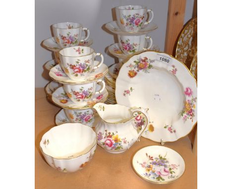 A Royal Crown Derby Posies pattern part tea service; including cups, saucers, side plates, dessert plates, jug, etc