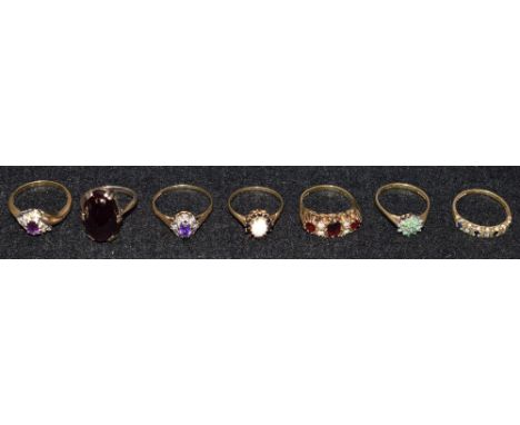 A 9ct gold ring, set with opal and garnett; other 9ct gold dress rings, set with assorted stones, 20g gross (7)