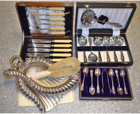 A fish knife and fork set with silver collars; crumb trays; spoons; etc.
