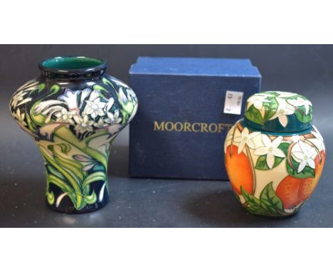 A Moorcroft Oranges pattern ginger jar and cover, boxed; a Moorcroft Lilacs pattern vase (2)