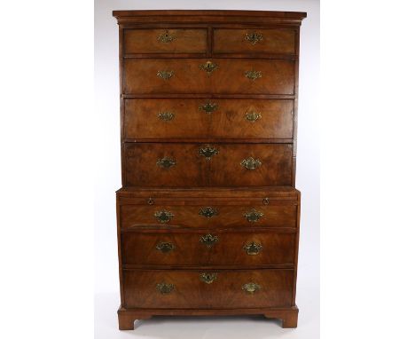 George III walnut secretaire chest on chest, the concave cornice above two short and two long drawers before the secretaire d