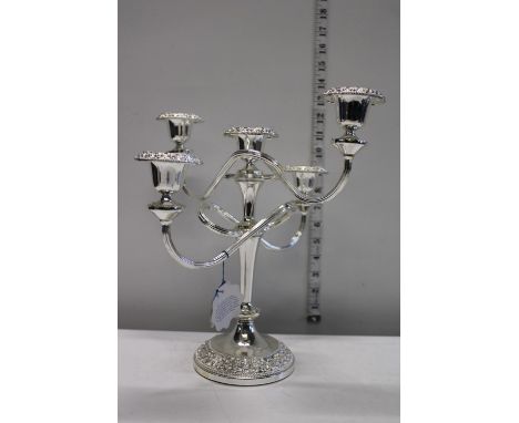 A good quality silver plated five branch candle stick 