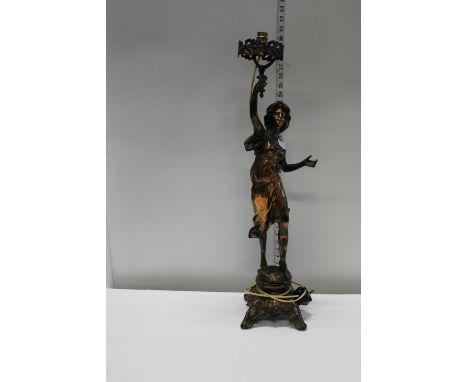 A bronzed spelter figure converted into a table lamp 