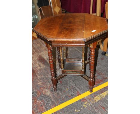 An antique hexagonal occasional table with bobbin turned legs and galleried shelf. Collection only 