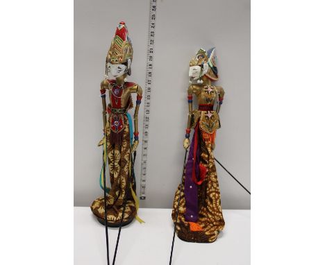 Two large wooden Thai shadow stick puppets 