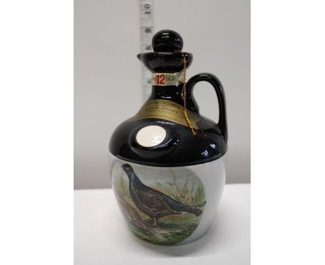 A sealed decanter of Rutherford's Scotch Whiskey 12 years old 26 2/3 FL Oz 
