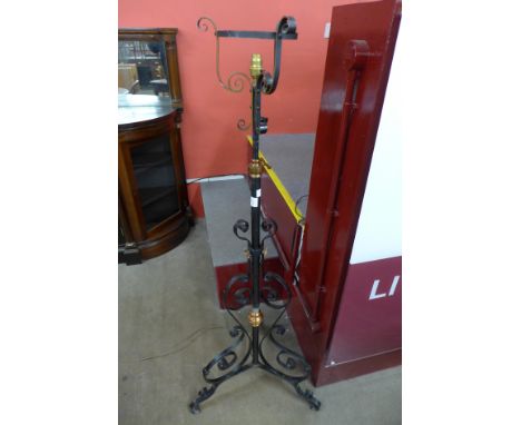 An Arts and Crafts copper and wrought iron telescopic standard lamp