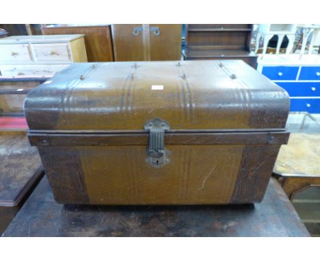 A tin steamer trunk
