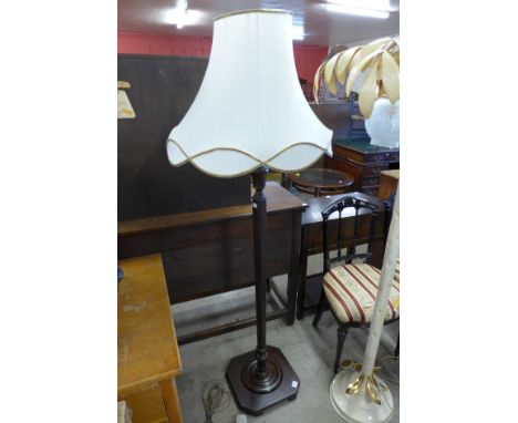 A mahogany standard lamp