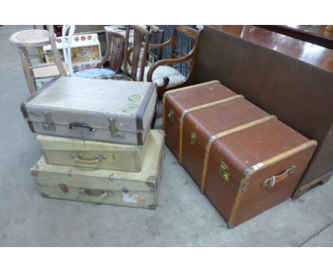 A steamer trunk and three cases