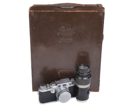 * Leica. Leica film camera and lenses, including Leica IIIf chrome camera body, serial number 603243, manufactured 1951-52, L