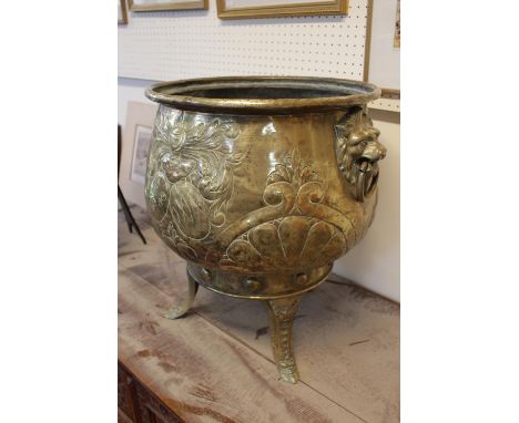 Very Large Victorian Cauldron shaped Brass embossed Log cucket on Tripod support, with Lions head handles 