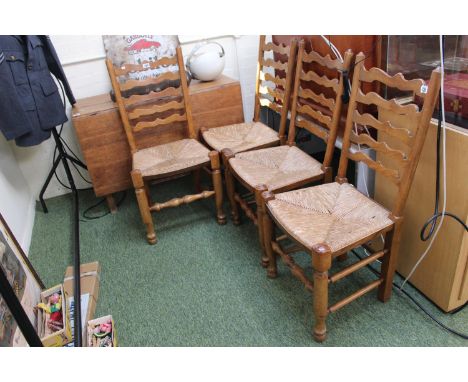 Set of 4 Ladder back dining chairs with rush seats and turned supports 