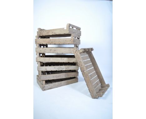 A set of 8 vintage industrial mid century apple crates - stacking. Wooden slatted construction. Measures: 16cms high x 77cms 
