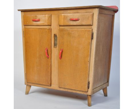 A vintage mid 20th century kitchen sideboard in beech wood with oak veneers having a red formica top with two drawers above c