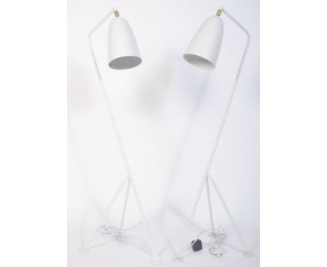 After Greta Grossman, a fabulous pair of large white grasshopper floor lamps. Having a tubular steel tripod frame with tilt a