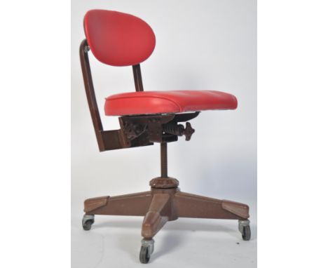 A vintage 20th century industrial swivel machinist chair. Raised on four painted &nbsp;metal tubular feet, adjustable height,