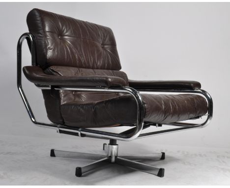 A stunning original 20th century / 1970's Pieff ' Alpha '  swivel armchair by Tim Bates. The large brown leather and chrome s