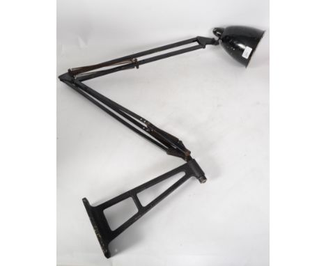 A large early 20th century Industrial wall mounted anglepoise desk / factory lamp having two tone black and white pendant sha