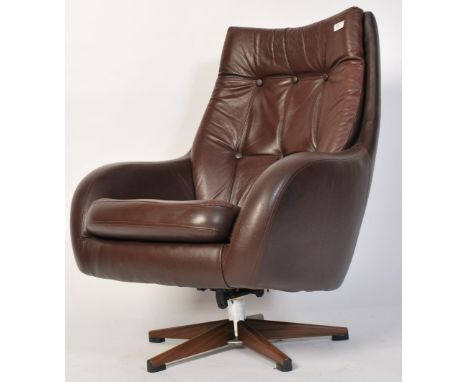 A vintage Scandinavian chocolate brown genuine leather swivel button back pod armchair with five spoke base and shaped back I
