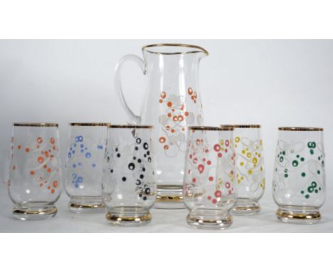 A hand painted vintage 1950's glass lemonade Pimms set comprising a gilt trimmed jug and six glasses.  This set is decorated 