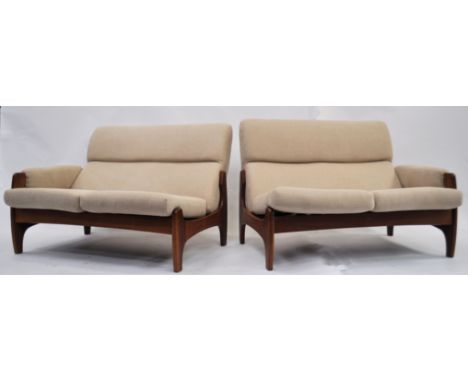 A 1960's mid century Danish teak modular ' twin ' sofa settee. Believed to be originally from Heals of London, the teak wood 