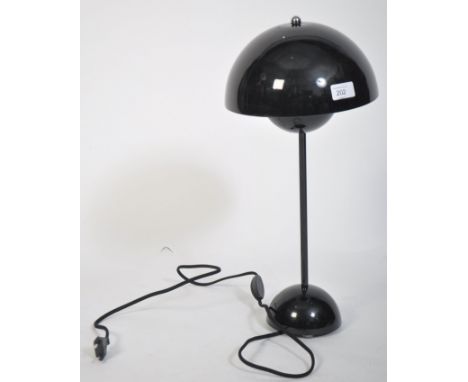 A contemporary flowerpot desk lamp in black by Louis Poulsen for Verner Panton. Domed half spheres in red lacquer on aluminiu