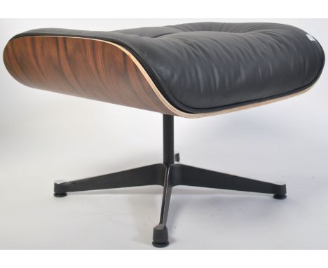 After Charles &amp; Ray Eames. A Herman Miller &nbsp;671 Ottoman raised on polished quadruped swivel base having bent-ply und