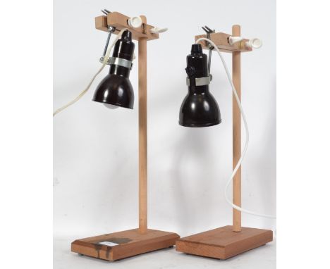A pair of mid century Industrial Laboratory / lab stands raised on wooden bracket supports with drop - anglepoise spot lights
