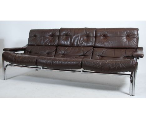 An original 20th century 1970's Pieff ' Alpha '  sofa by Tim Bates. The stunning large brown leather and chrome sofa settee r