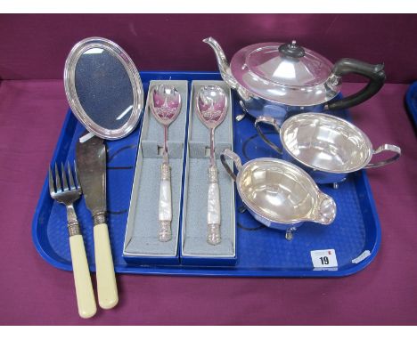 A Plated Four Piece Tea Set, of oval panelled form; together with an oval photograph frame, decorated mother of pearl handled