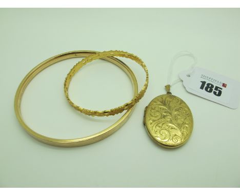 A Vintage Andreas Daub Upper Arm Bangle, stamped "A*D", of plain design, internal diameter 8.3cm; a rolled gold oval locket p