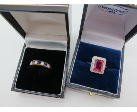 A Modern Rectangular Cluster Style Ring, four claw centre, within an illusion set border, between tapered shoulders, stamped 