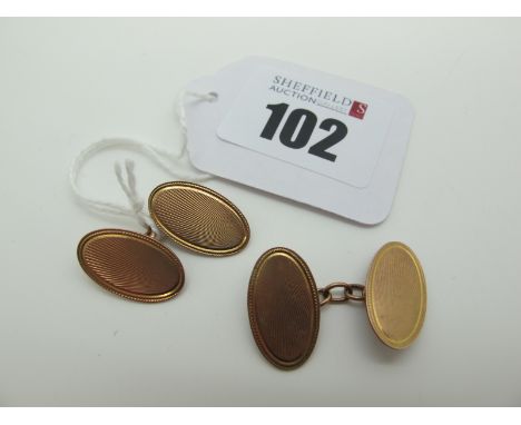 A Pair of 9ct Rose Gold Cufflinks, the engine turned oval panels on chain connections (5grams). 