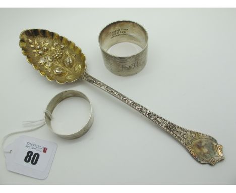 A Hallmarked Silver Berry Spoon, with gilt fruit decorated shaped bowl and foliate engraved handle; a hallmarked silver napki