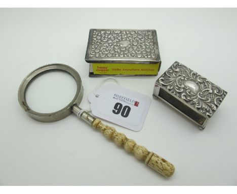 Two Hallmarked Silver Matchbox Covers, each detailed in relief; a bone handled 'Stanhope' magnifying glass ('A Memory of Pads