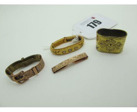 A Victorian Diamond Set Scarf Clip, star set with diamond chips, stamped "15"; together with another scarf clip, of belt buck