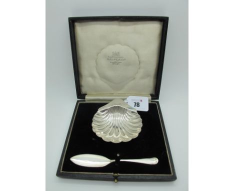 A Hallmarked Silver Shell Butter Dish, in original fitted case with a hallmarked silver butter knife. 