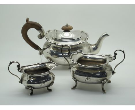 A Hallmarked Silver Three Piece Tea Set, Walker &amp; Hall, Birmingham 1918 (some marks rubbed), initialled (total weight 945