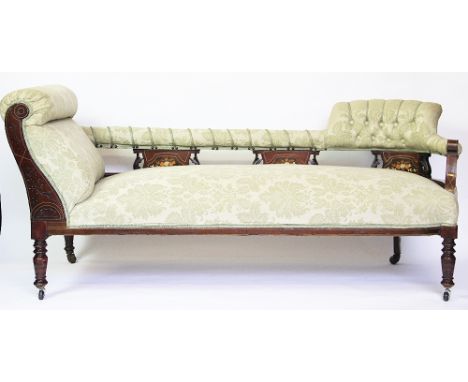 An Victorian mahogany and inlaid chaise lounge, the open work back flaked by a button back and scroll end above a upholstered