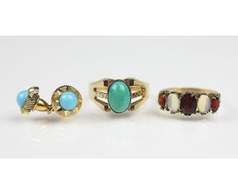 A turquoise set dress ring, indistinctly stamped, a five stone garnet and opal ring set in 9ct gold, a pair of stud earrings 