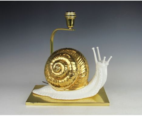 A gilt porcelain and brass snail lamp by Mangani, 40cm. Sold with am email of authenticity from Giulia Mangani Florence. It i
