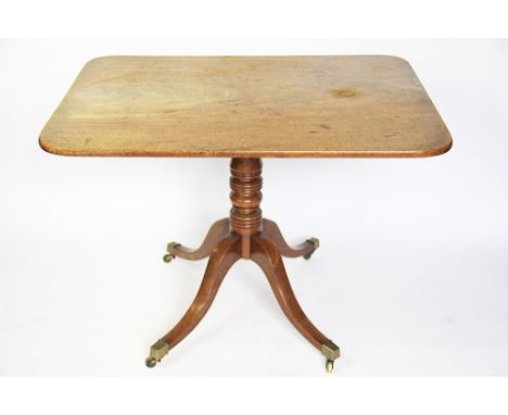 An early 19th century mahogany rectangular tilt top table, with turned column and tripod base, 73cm H x 103cm W x 77cm D