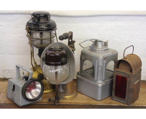 A paraffin Tilly lamp, with glass shade, with two signal lamps, a hand held British Rail lamp and a larger paraffin lamp (5)