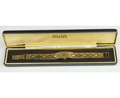 A lady's Avia wristwatch, the square dial with black opal set face and gilt batons, with integral tri-colour gold brick link 