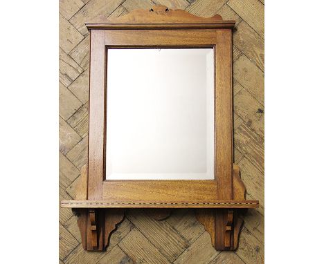 An Edwardian walnut wall mirror, with shelf, 64cm H x 49cm W