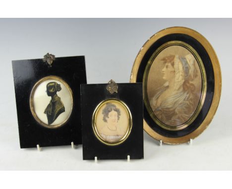 A mid 19th century bronzed silhouette miniature of a lady, titled verso 'Elizabeth Rabone, 1950, dine in Isle of Man', 8.7cm 