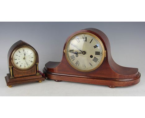 An Edwardian lancet shaped mantle clock, the oak and inlaid case with brass supports, the white circular dial with black Roma