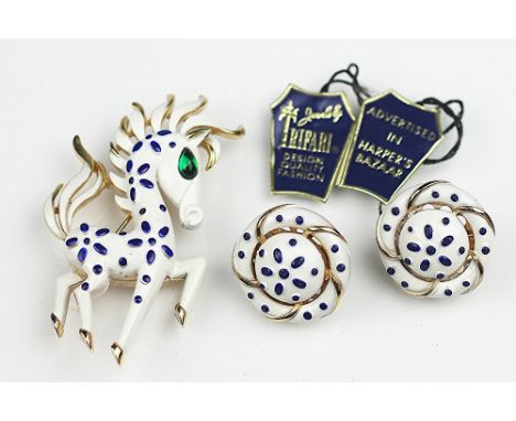 A Trifari brooch and earrings suite, designed as an enamelled strutting stylised horse, 6cm long, and a pair of matching clip